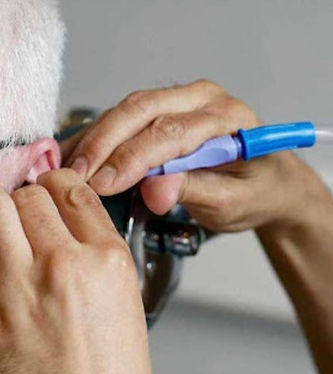 Ear irrigation treatment
